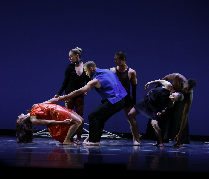 Battery Dance, four dancers in various poses
